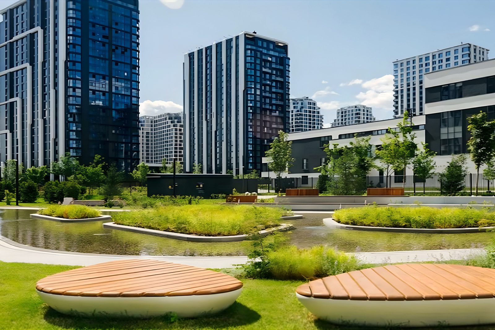 Landscaped courtyard with water basin and round benches, towers behind